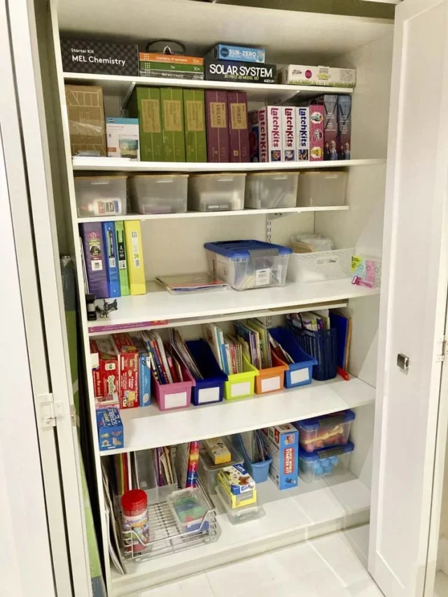 Beautifully organized cupboard full of toys, game boards, craft materials - After picture